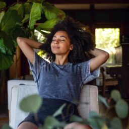 woman leaning back in a chair breathing in the fresh air