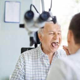 Man in a throat exam