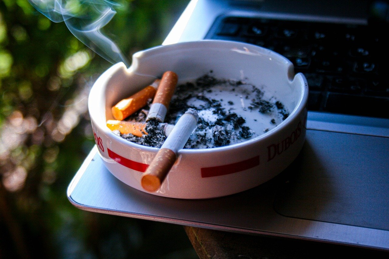 an ashtray with cigarettes in it